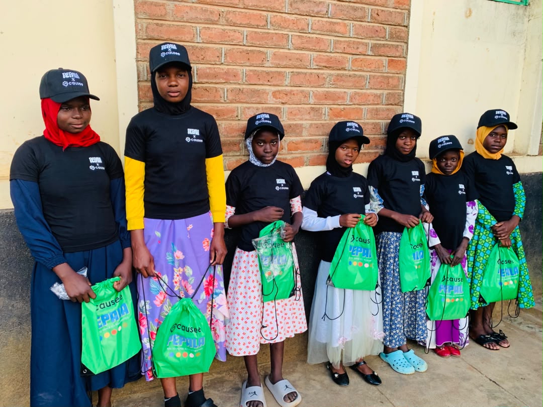 Girls in Malawi with their Pepala x Causee school bags and caps