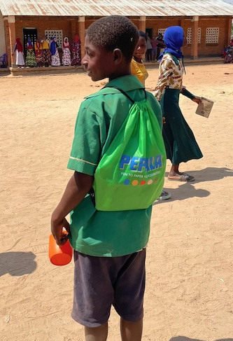 A child in Malawi with a green Pepala school bag