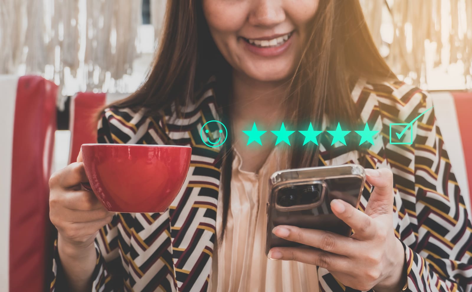 A shopper reading five-star reviews on a phone while holding a cup of coffee